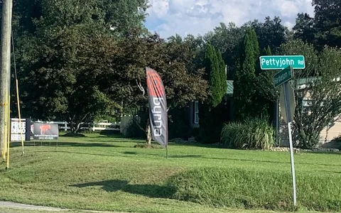 Elite Defense Equipment seen from Pettyjohn Road in Milton, Delaware, with a Byrna flag on the front lawn